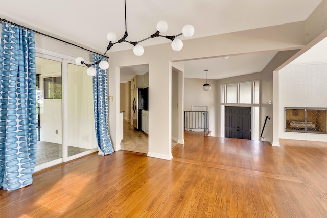 unfurnished living room with wood-type flooring