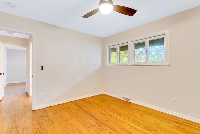 unfurnished room with light hardwood / wood-style flooring and ceiling fan