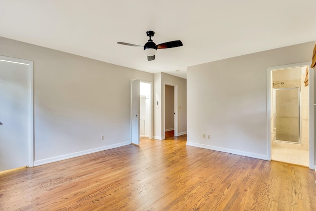 unfurnished bedroom with light wood-type flooring, ceiling fan, and ensuite bathroom