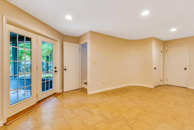 unfurnished room with light parquet flooring