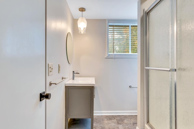 bathroom featuring an enclosed shower and vanity