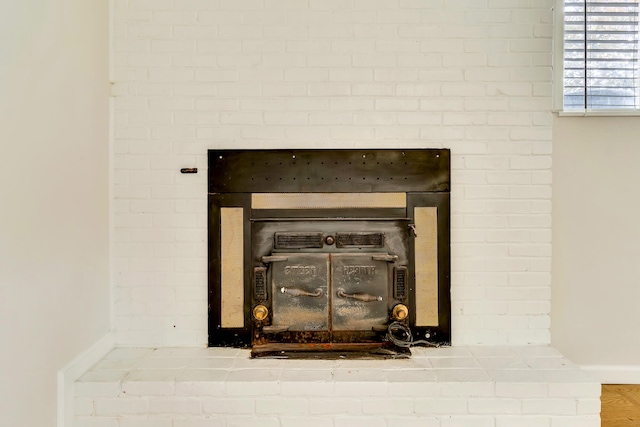 details with a brick fireplace