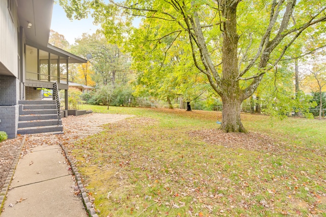 view of yard with a sunroom