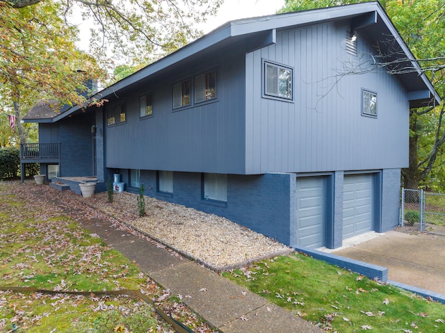 view of property exterior with a garage