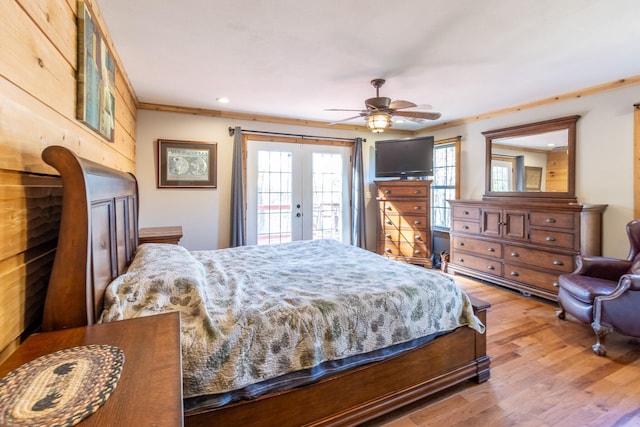 bedroom with access to outside, french doors, wood-type flooring, ornamental molding, and ceiling fan