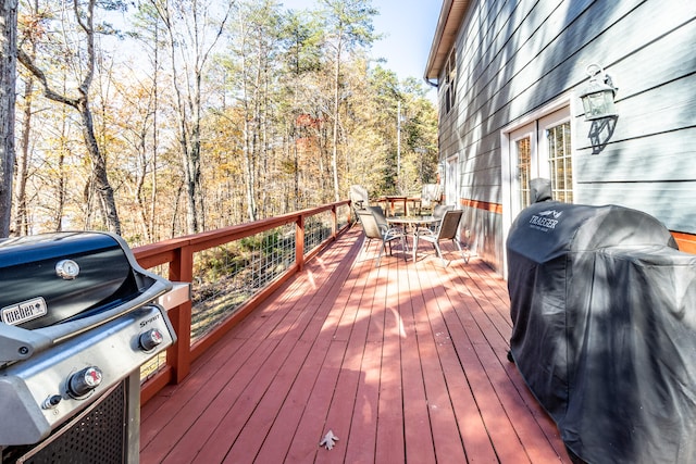 wooden deck featuring area for grilling