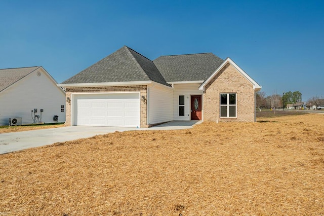 view of front of property featuring brick siding, a garage, driveway, and a shingled roof