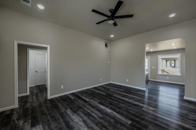 spare room with recessed lighting, a ceiling fan, dark wood-style flooring, and baseboards