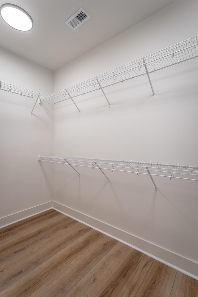 walk in closet featuring wood-type flooring