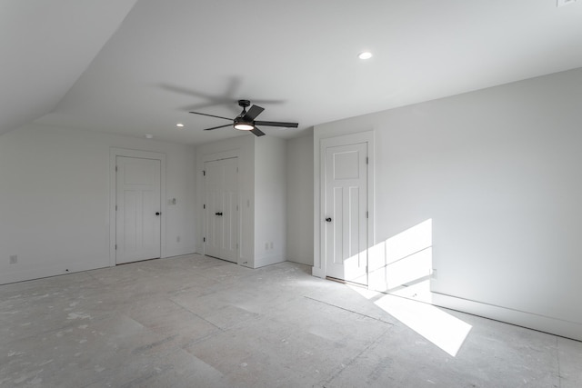 interior space with ceiling fan