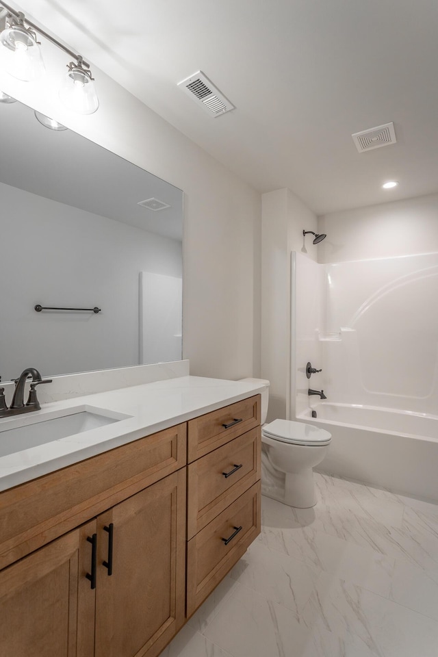 full bathroom with vanity, toilet, and  shower combination