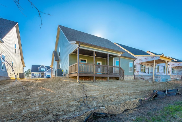 view of front of home featuring a porch and central air condition unit