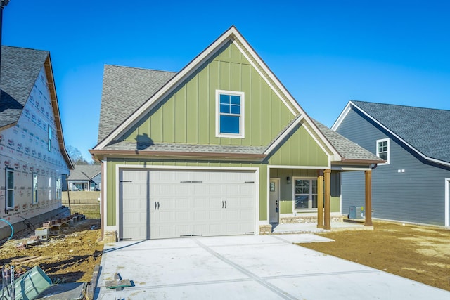 view of front of property with a garage and covered porch