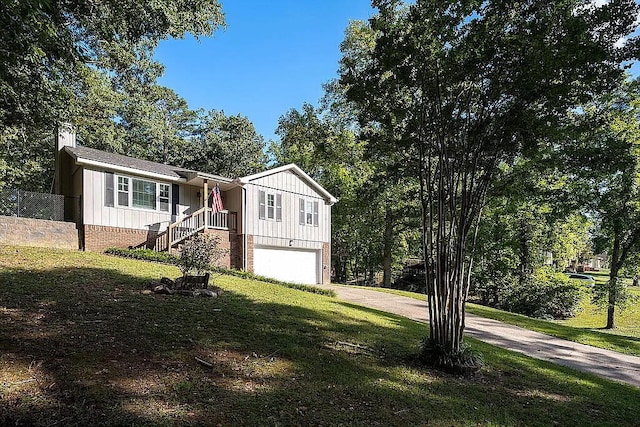 view of front of home with a garage and a front yard