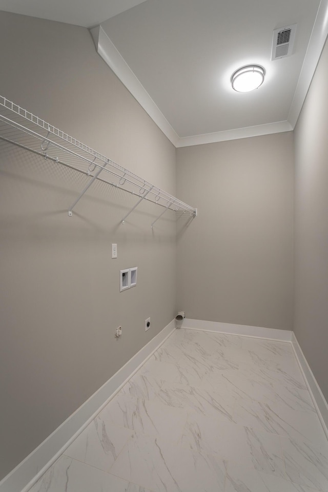 clothes washing area featuring washer hookup, ornamental molding, hookup for an electric dryer, and gas dryer hookup