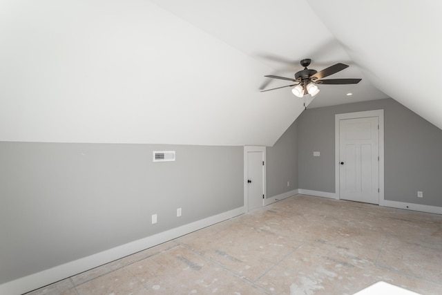 additional living space featuring lofted ceiling and ceiling fan