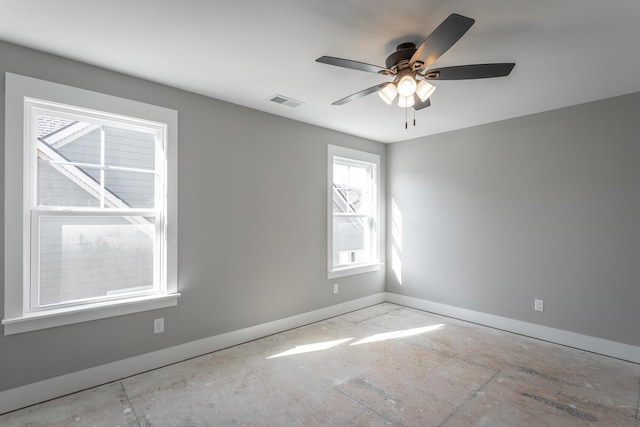 spare room with ceiling fan