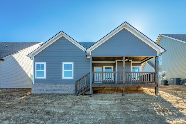 view of front facade featuring a wooden deck and central AC