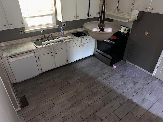 kitchen with dishwasher, white cabinetry, sink, and gas cooktop