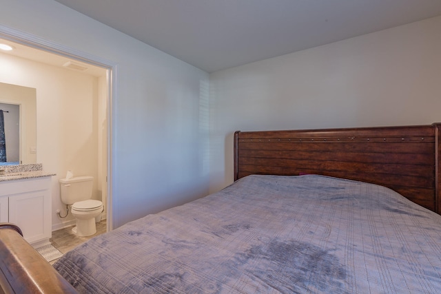 bedroom featuring ensuite bathroom