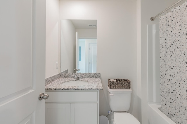 full bathroom featuring shower / bath combo, toilet, and vanity