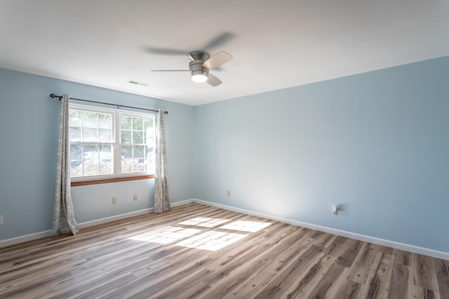 unfurnished room with light hardwood / wood-style floors and ceiling fan