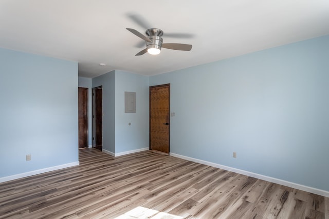 empty room featuring light hardwood / wood-style floors and ceiling fan