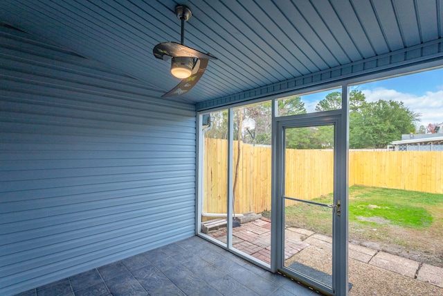 unfurnished sunroom featuring wood ceiling and vaulted ceiling