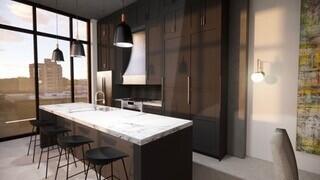 kitchen featuring dark brown cabinetry, sink, a breakfast bar, wall chimney exhaust hood, and a kitchen island with sink