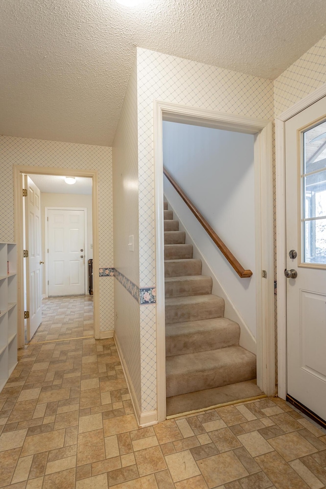 interior space with a textured ceiling