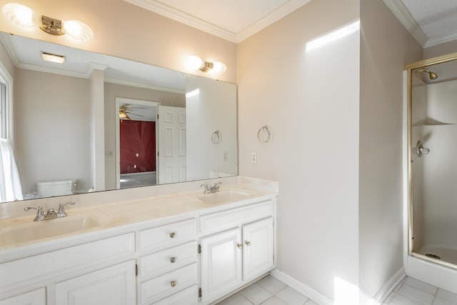 bathroom featuring toilet, an enclosed shower, ornamental molding, vanity, and ceiling fan