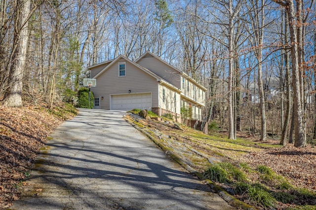 view of property exterior with a garage