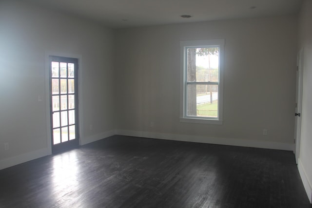 empty room featuring dark wood-type flooring