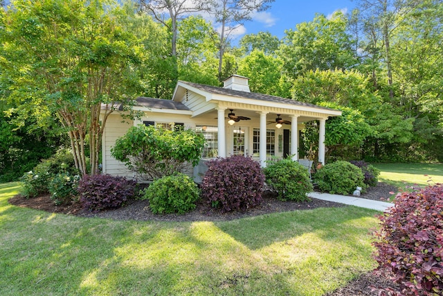 view of yard with ceiling fan