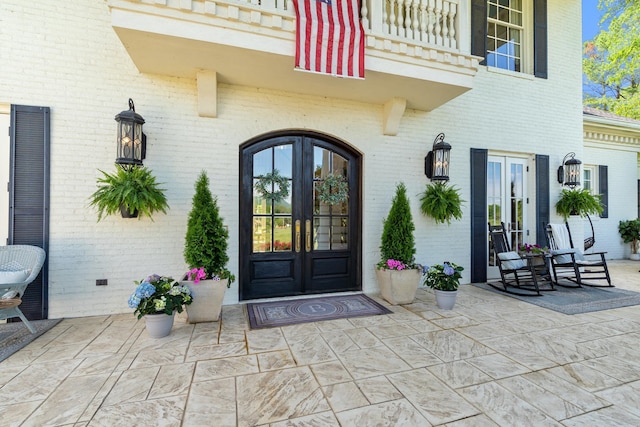 doorway to property with french doors and a balcony