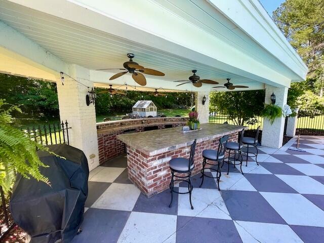 view of patio / terrace featuring exterior bar and area for grilling