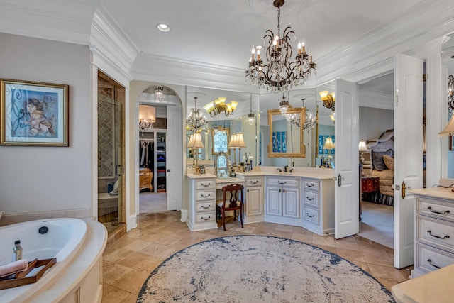 bathroom featuring vanity, crown molding, and independent shower and bath