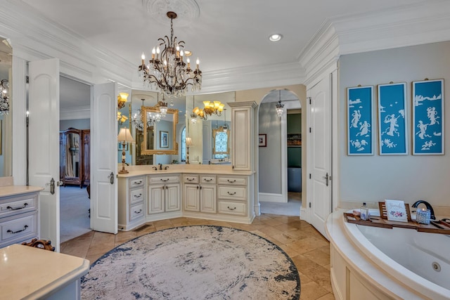 bathroom with ornamental molding, a tub to relax in, vanity, a notable chandelier, and tile patterned floors