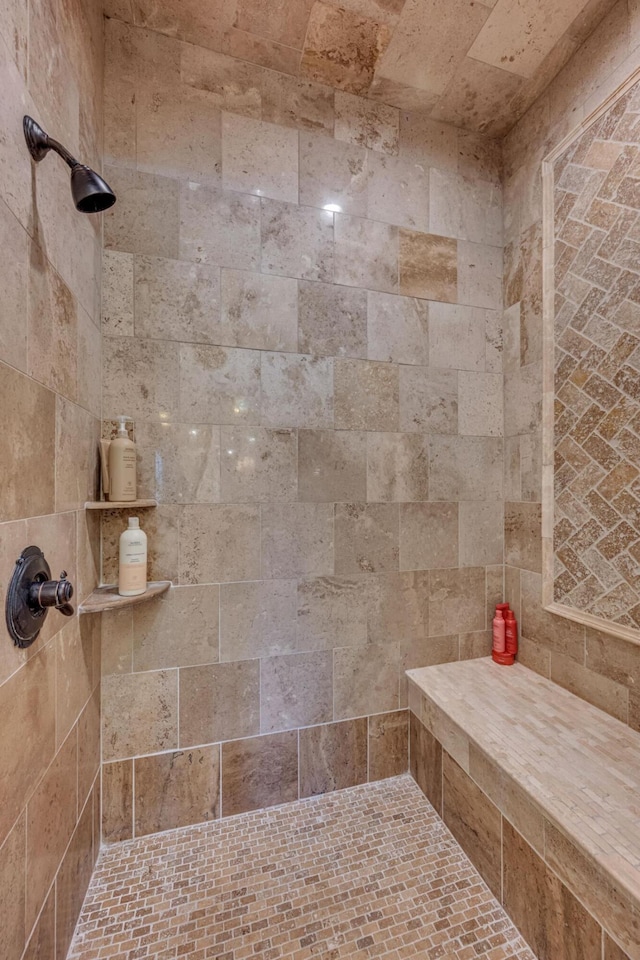 bathroom with a tile shower