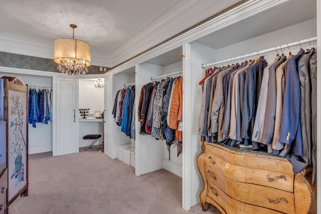 spacious closet featuring light carpet and a notable chandelier