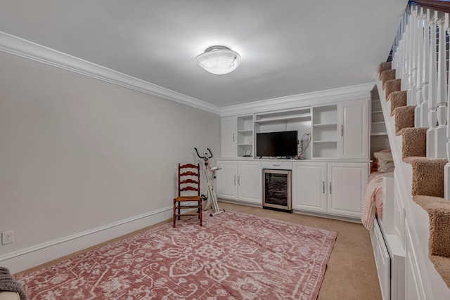 sitting room with light carpet and crown molding