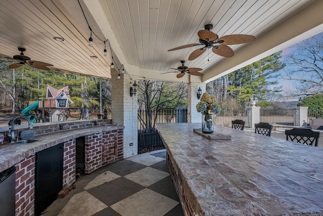 view of patio with an outdoor wet bar