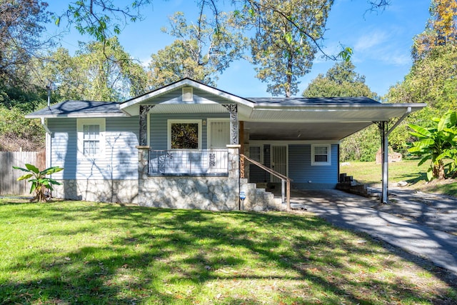 view of front of home featuring a porch, a front yard, and a carport