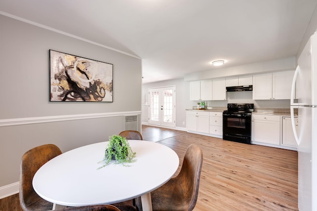 dining space with french doors, ornamental molding, and light wood-type flooring