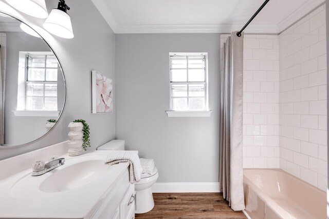 full bathroom featuring shower / bath combination with curtain, toilet, hardwood / wood-style flooring, vanity, and ornamental molding