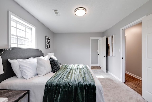 bedroom featuring light wood-type flooring