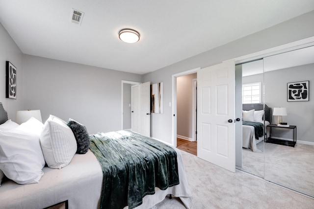 carpeted bedroom featuring a closet