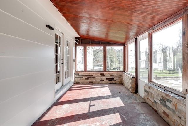 unfurnished sunroom with french doors, wooden ceiling, and vaulted ceiling