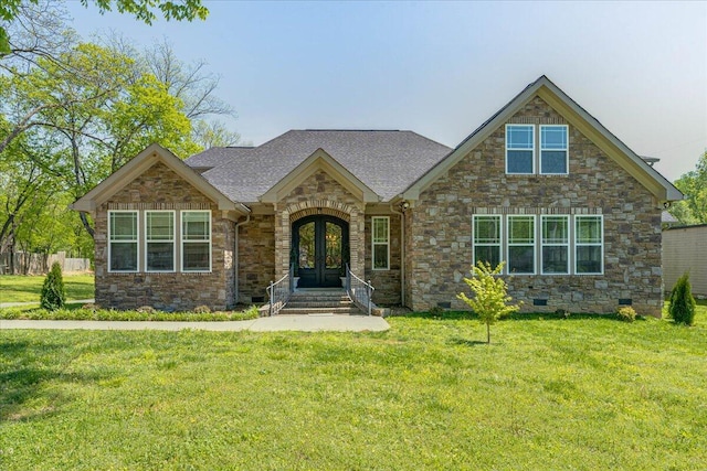 view of front facade featuring a front yard and french doors