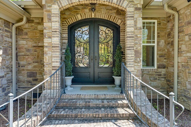 doorway to property featuring french doors